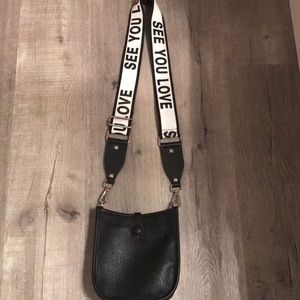 Leather bag with canvas strap and leather cross body strap.